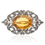 AN ANTIQUE CITRINE AND DIAMOND BROOCH, 19TH CENTURY in yellow gold and silver, the oval cut