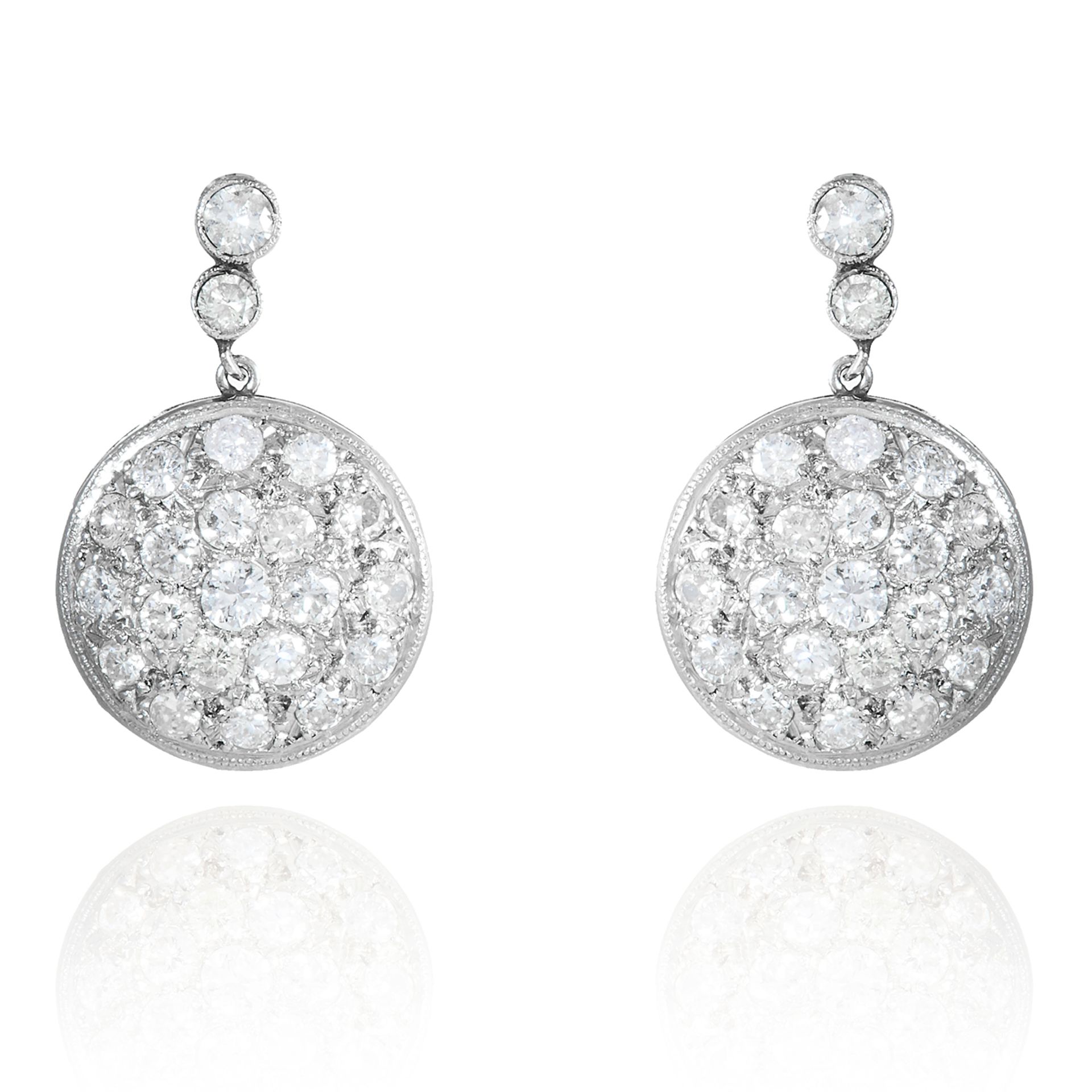 A PAIR OF DIAMOND EARRINGS in white gold or platinum, comprising of a diamond stud suspending