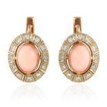 A PAIR OF CORAL AND DIAMOND EARRINGS in yellow gold, each oval cluster with coral at the centre,