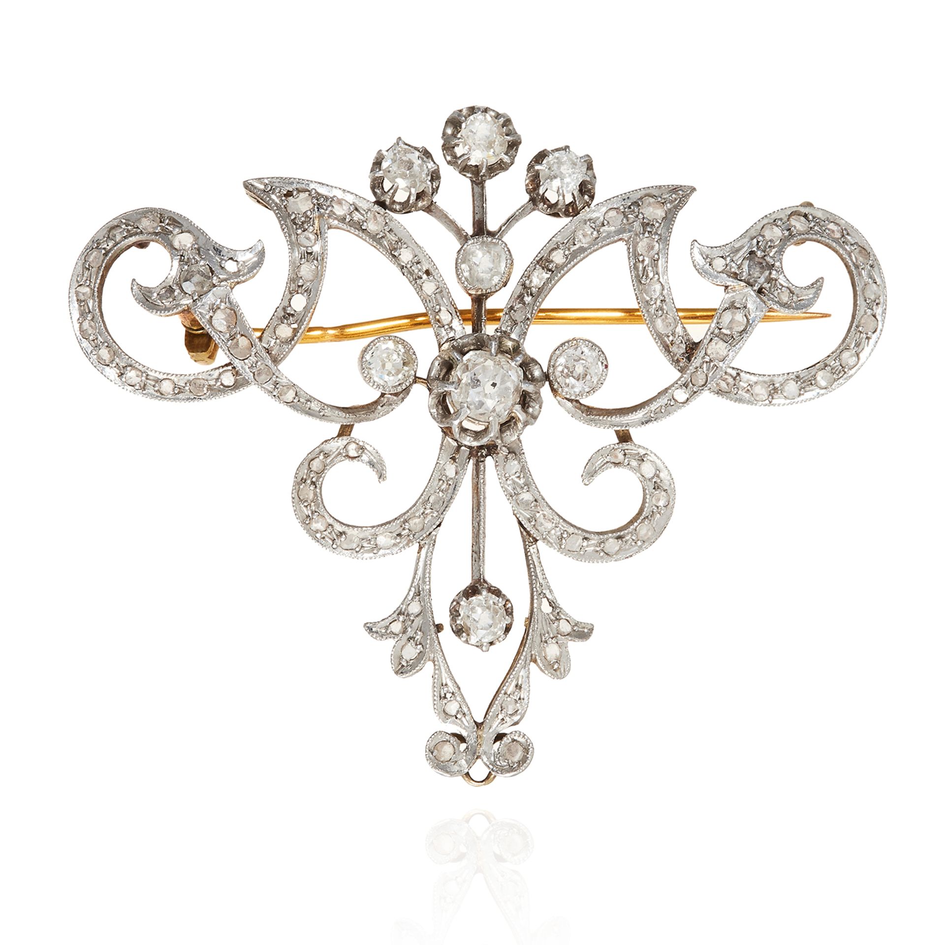 AN ANTIQUE DIAMOND BROOCH in high carat yellow gold, jewelled with scrolling foliate design jewelled