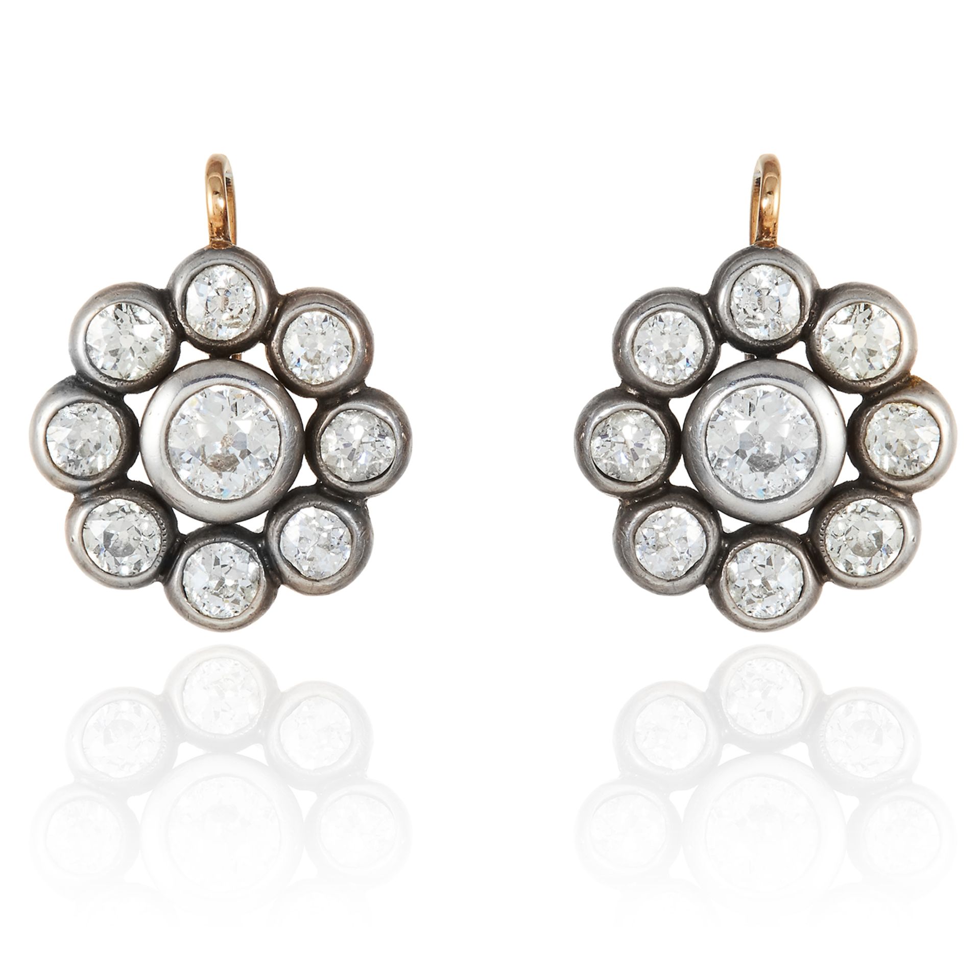 A PAIR OF ANTIQUE DIAMOND CLUSTER EARRINGS in yellow gold, in cluster form jewelled with old cut