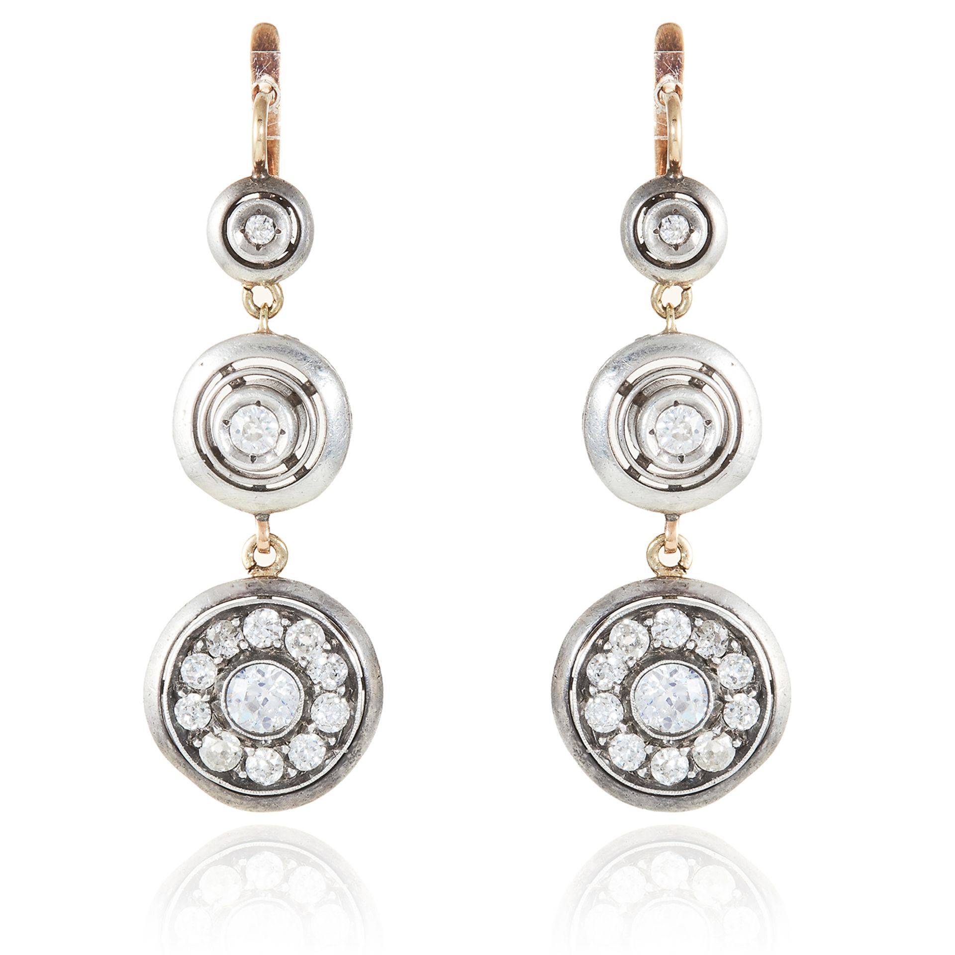 A PAIR OF DIAMOND EARRINGS in gold or platinum, each comprising of three circular discs set with old