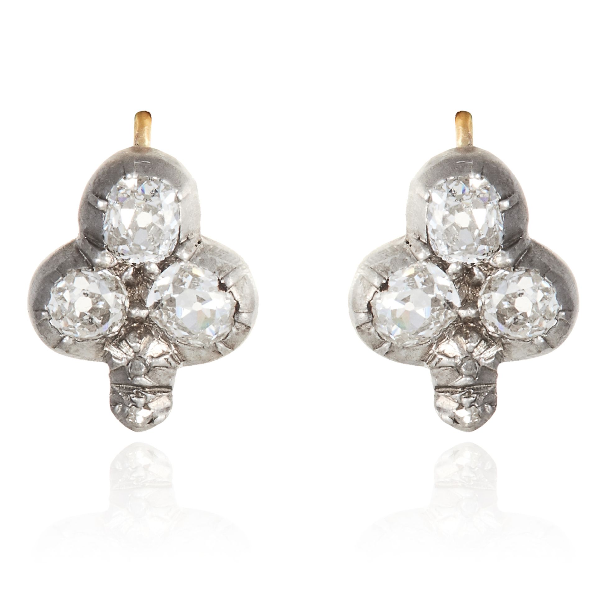 A PAIR OF DIAMOND CLOVER EARRINGS in yellow gold and silver, each set with a trio of old cut