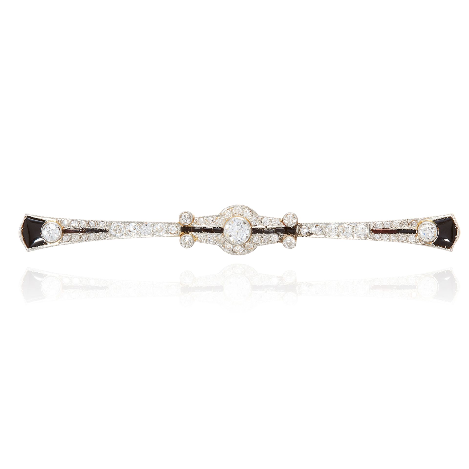 AN ART DECO DIAMOND AND ONYX BAR BROOCH in yellow gold and platinum, designed as Art Deco motif