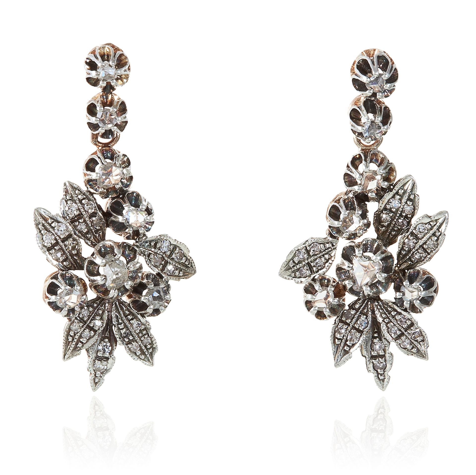 A PAIR OF ANTIQUE DIAMOND EARRINGS in high carat yellow gold and silver, designed as floral