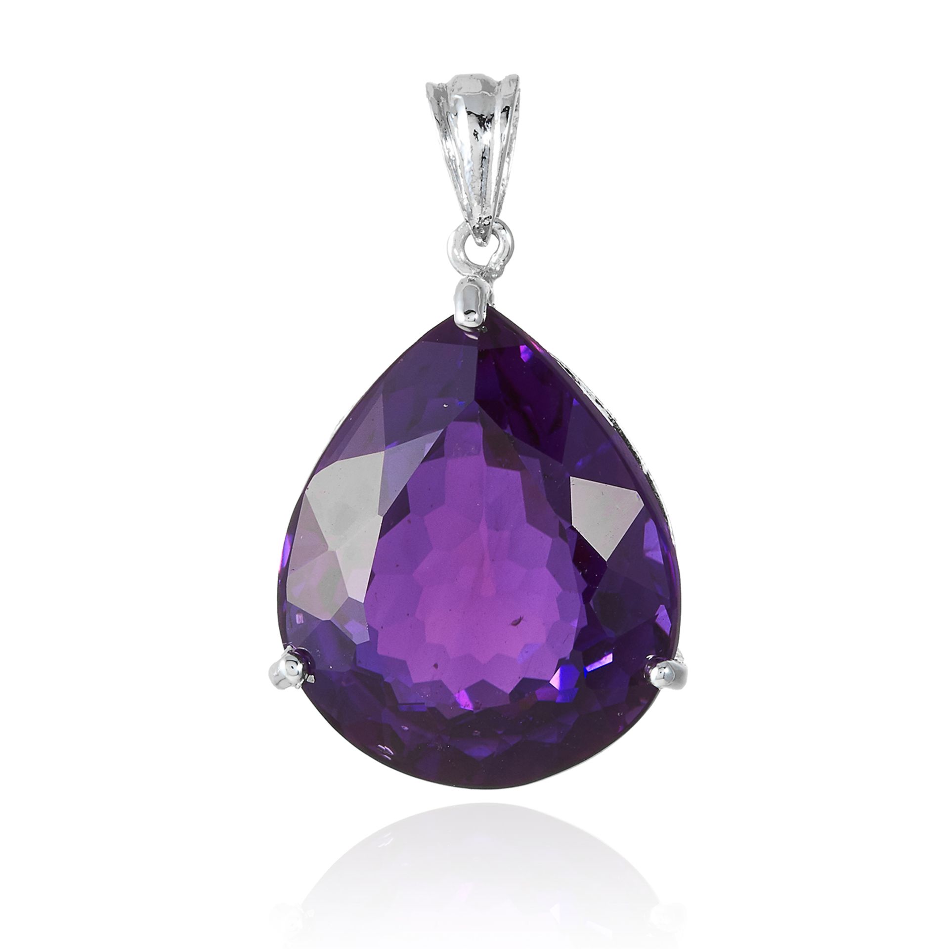 AN AMETHYST PENDANT set with a pear cut amethyst, unmarked, 3.5cm, 8.6g.