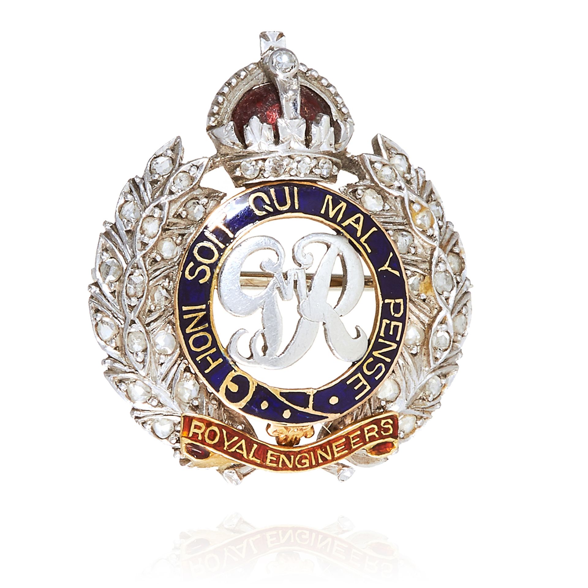 AN ANTIQUE ROYAL ENGINEERS BROOCH in silver and gold, jewelled in enamel, unmarked, 2.4cm, 7.2g.