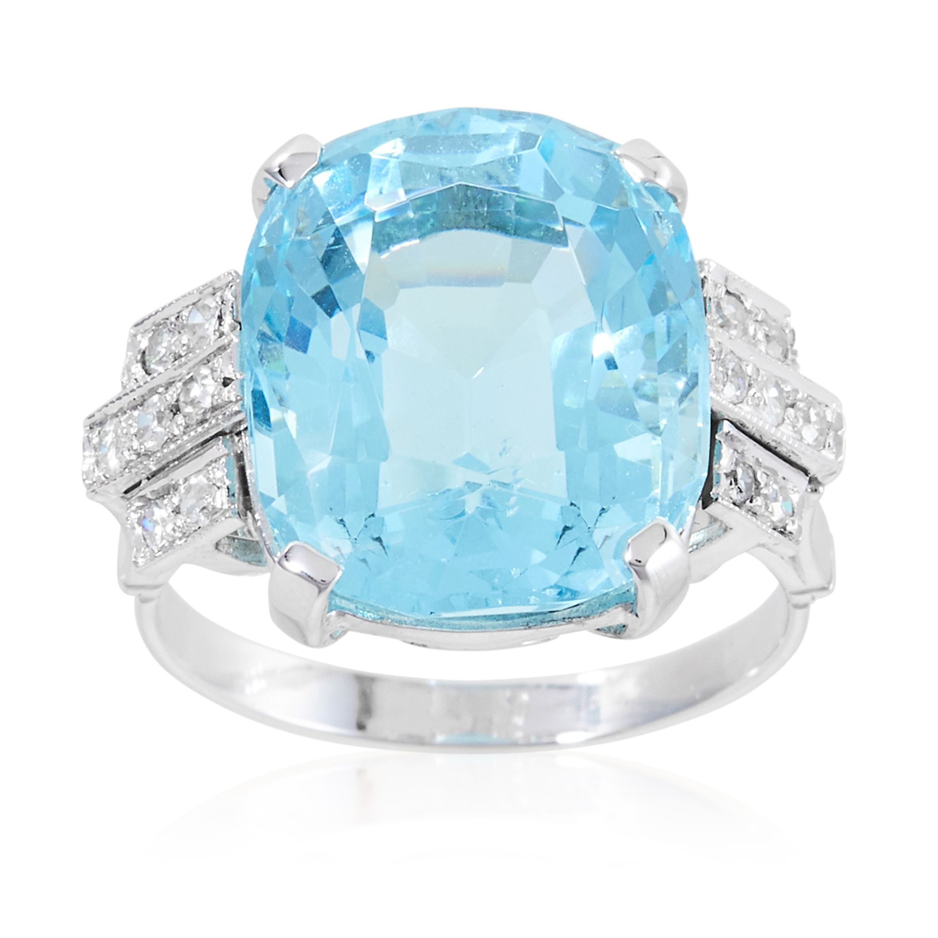 AN ART DECO AQUAMARINE AND DIAMOND RING in platinum or white gold, set with a cushion cut aquamarine