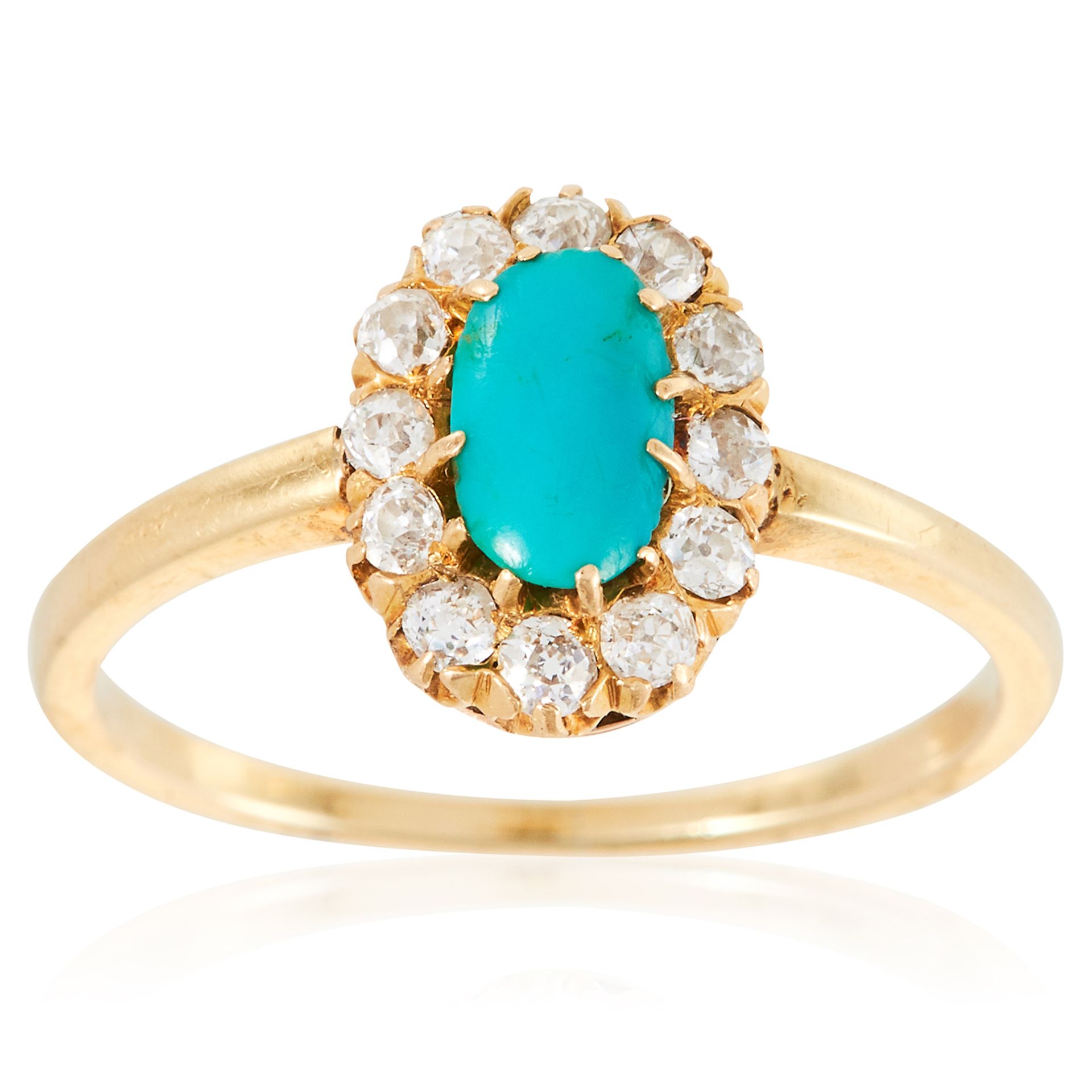 A TURQUOISE AND DIAMOND CLUSTER RING in high carat yellow gold, set with a cabochon turquoise in a