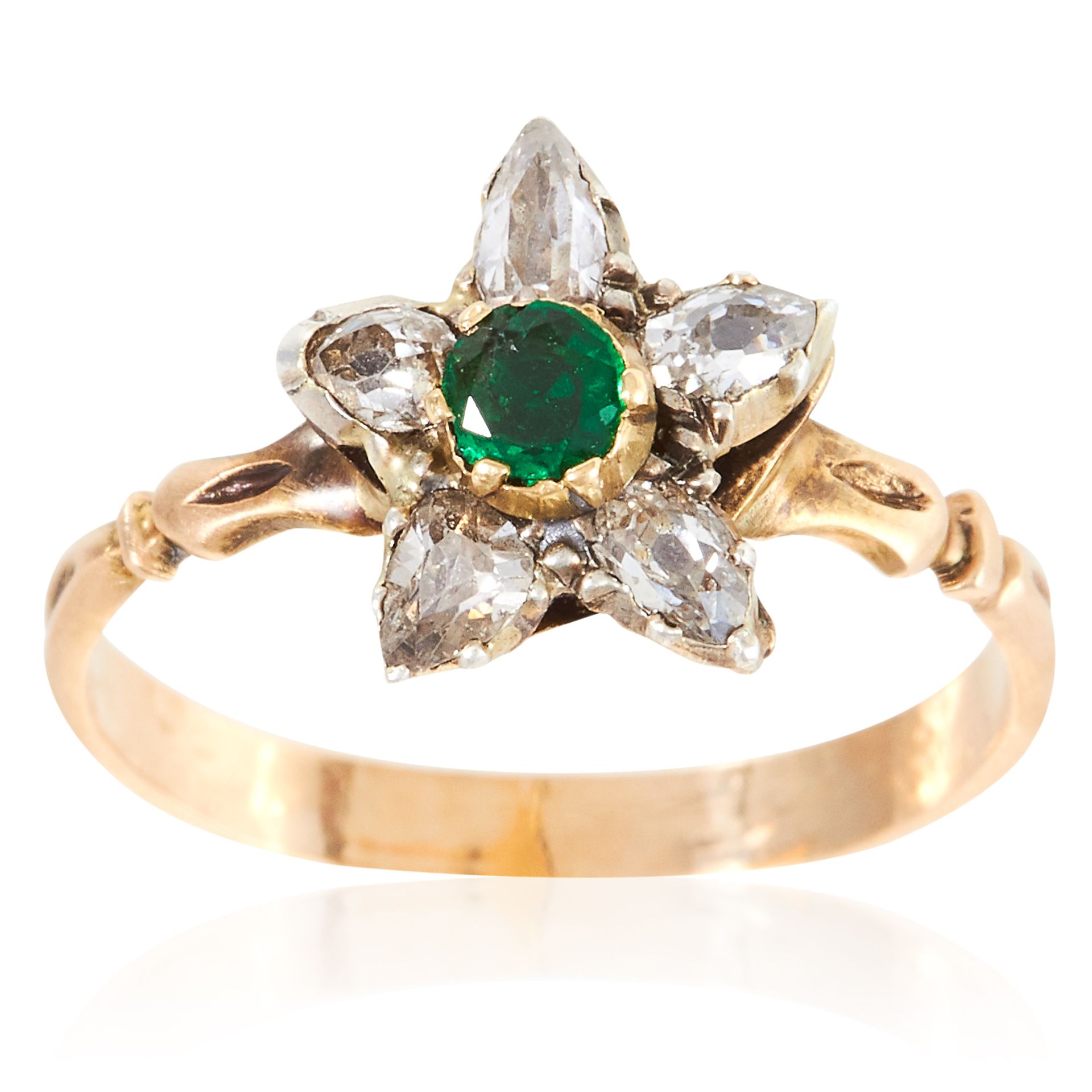 AN ANTIQUE EMERALD AND DIAMOND RING in high carat yellow gold, depicting a flower set with a round