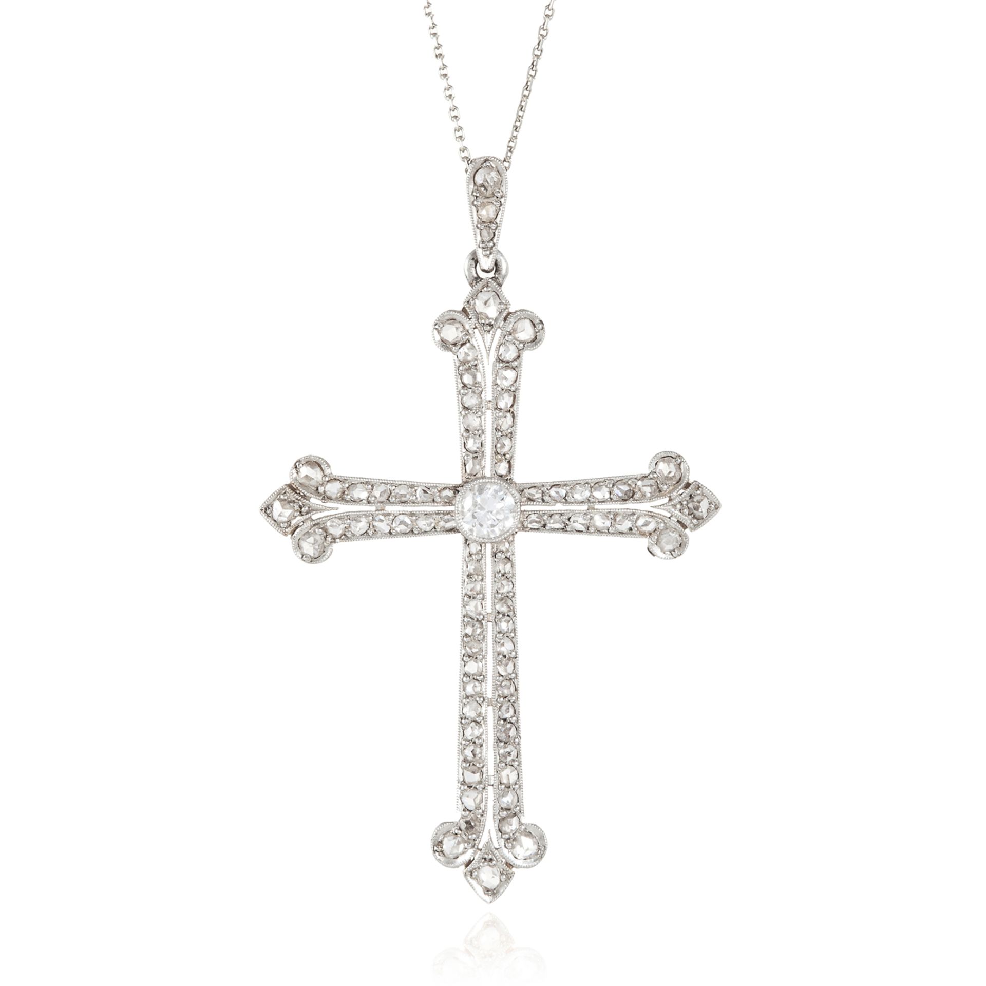 AN ANTIQUE DIAMOND CRUCIFIX PENDANT in gold and platinum, the cross design jewelled with round and