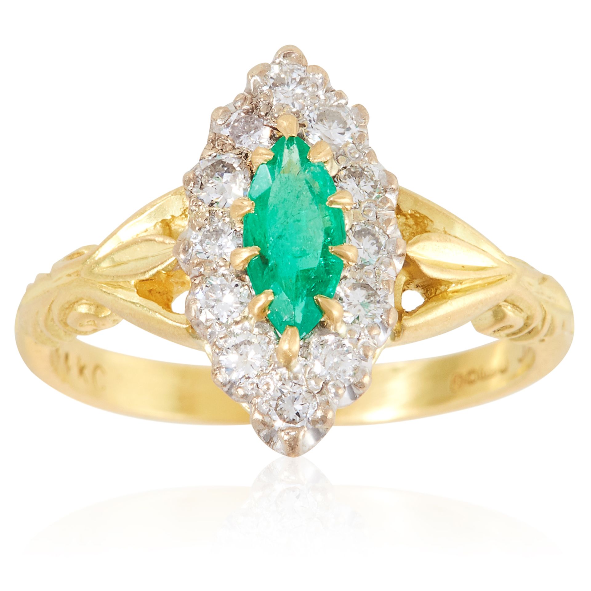 AN EMERALD AND DIAMOND RING in 18ct yellow gold, the marquise cut emerald encircled by round cut