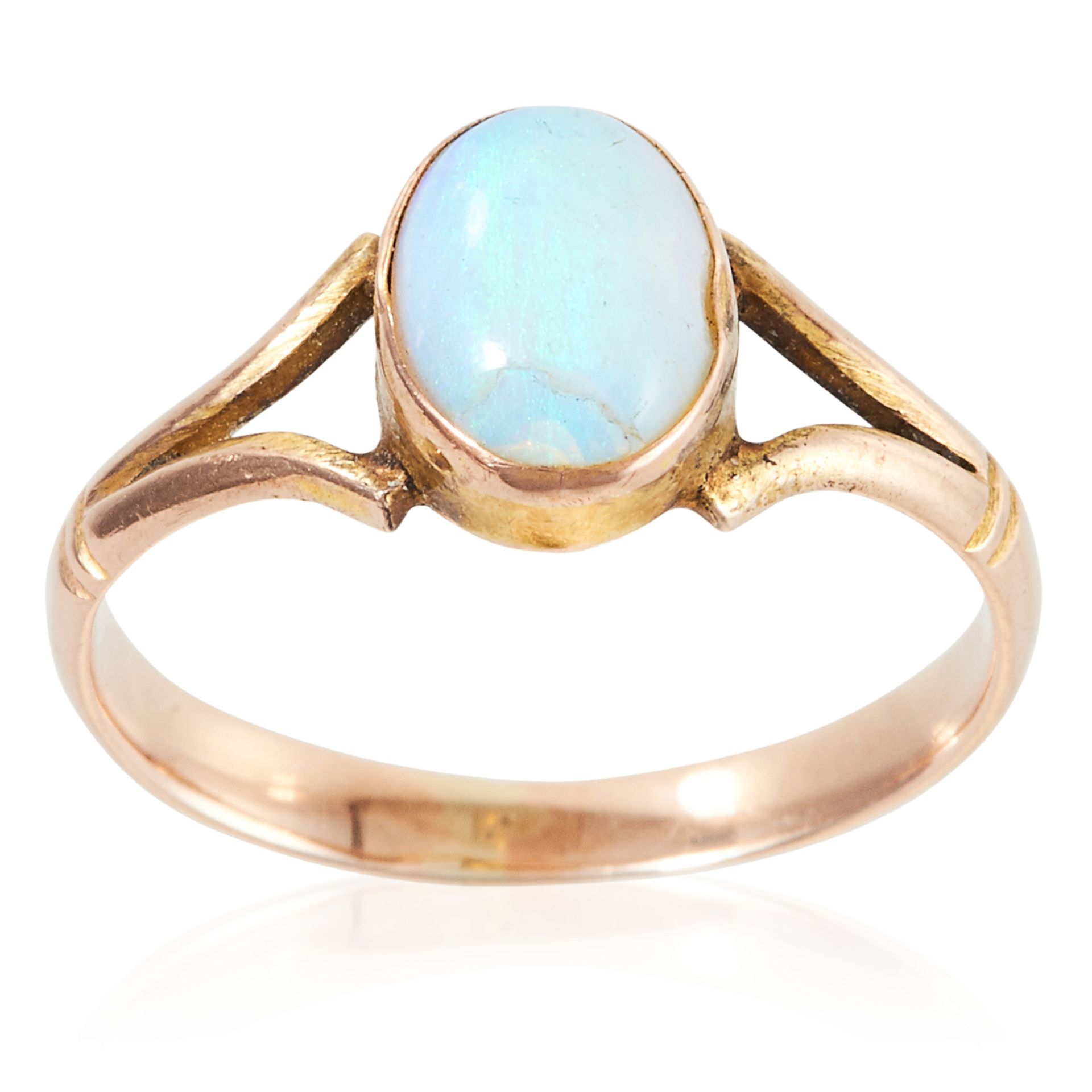 AN OPAL DRESS RING in yellow gold, set with an oval cabochon opal to a bifurcated band, unmarked,