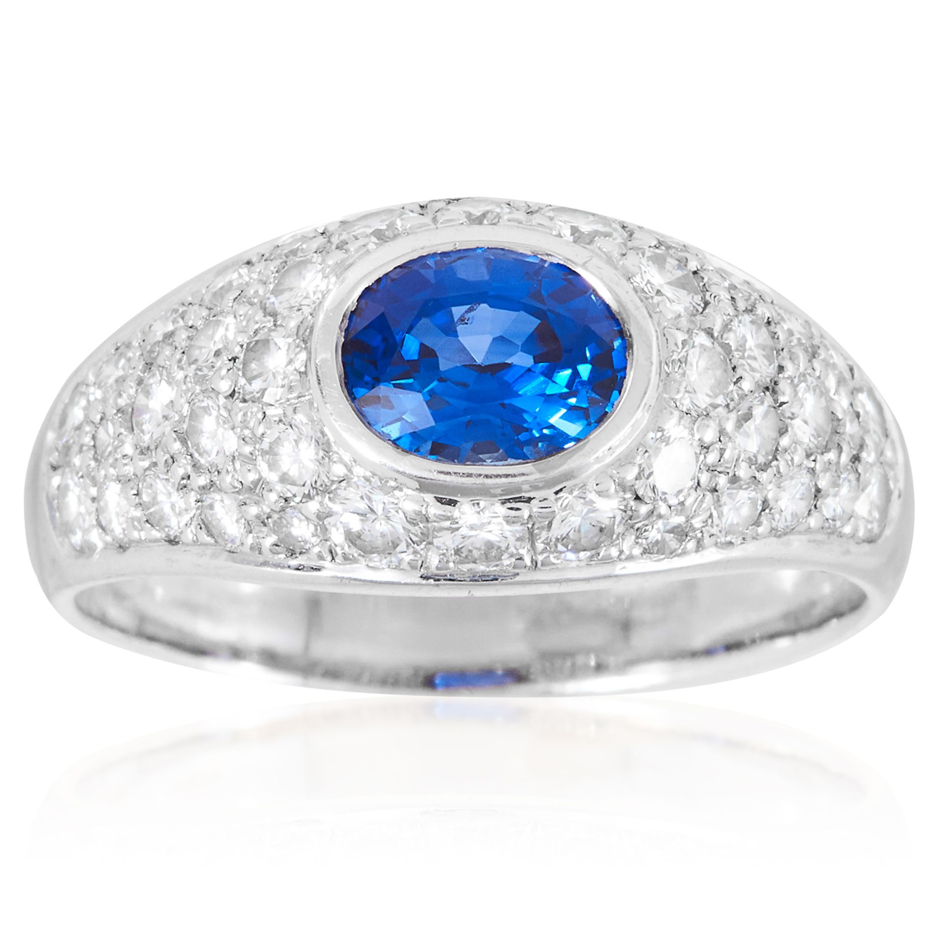 A CEYLON SAPPHIRE AND DIAMOND DRESS RING in 18ct white gold, set with an oval cut sapphire of 1.08