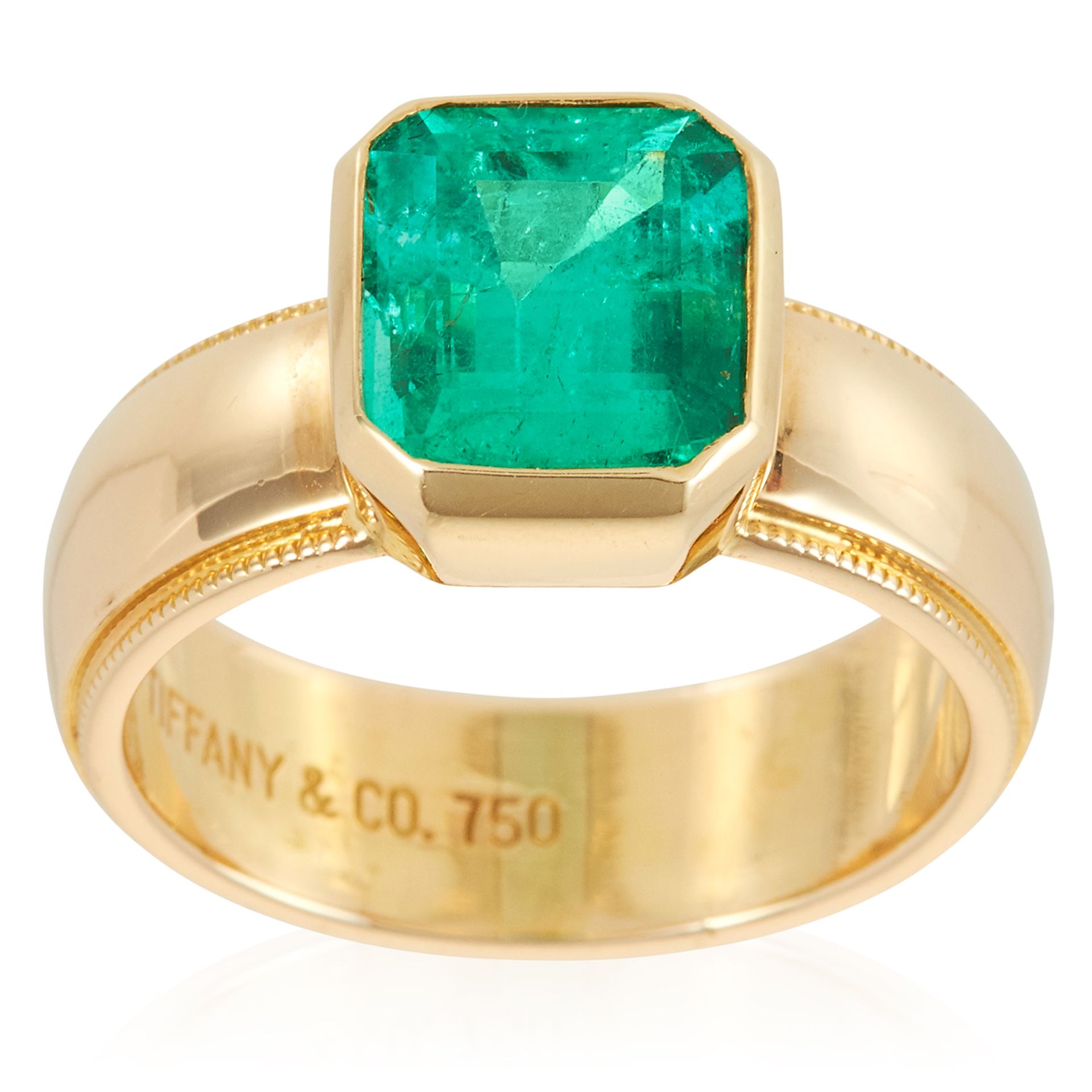 A 2.85 CARAT COLOMBIAN EMERALD RING, TIFFANY & CO in 18ct yellow gold, set with a step cut emerald