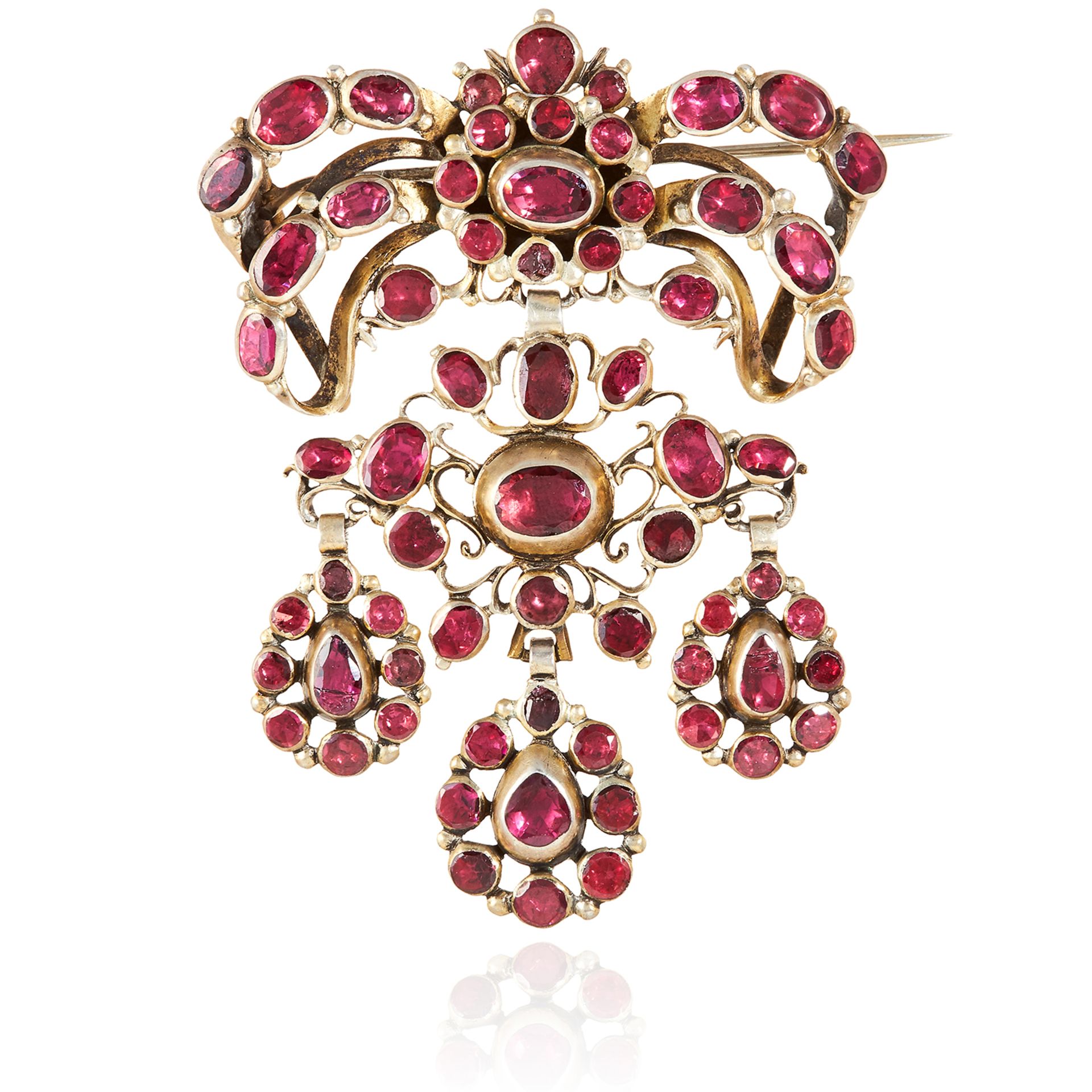 AN ANTIQUE GARNET BROOCH, SPANISH CIRCA 1900 the articulated ribbon motifs jewelled with oval, round