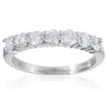 A 0.90 CARAT DIAMOND HALF ETERNITY RING in 18ct white gold, set with seven round cut diamonds