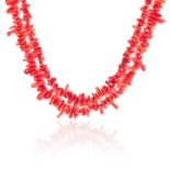 A CORAL BEAD NECKLACE comprising of two rows of coral sprigs, 60cm, 131.1g.