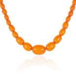 AN AMBER BEAD NECKLACE comprising of forty-three amber beads, 46cm, 19.8g.