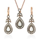A DIAMOND PENDANT AND EARRINGS SUITE in yellow gold, with pendant and earrings comprising of pear