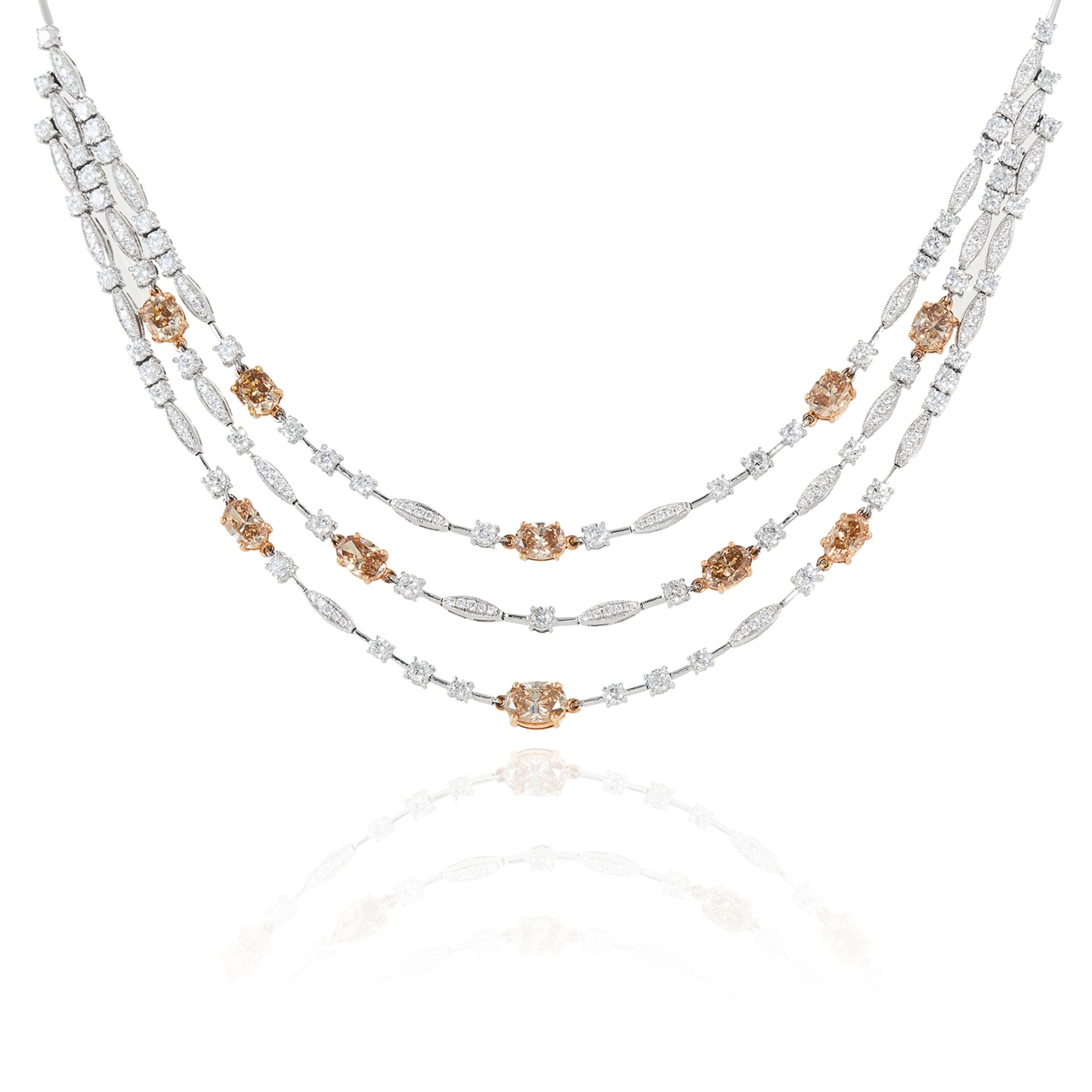 A 10.90 CARAT DIAMOND NECKLACE in 18ct white gold, designed as a trio of rows of white diamond