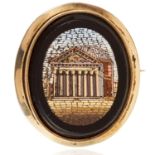 AN ANTIQUE MICROMOSAIC BROOCH in yellow gold, the oval body decorated with various polished