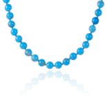 AN ANTIQUE TURQUOISE HARDSTONE BEAD NECKLACE comprising a single row of thirty-three polished