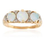 AN ANTIQUE OPAL AND DIAMOND RING in 18ct yellow gold, set with a trio of oval cabochon opals