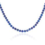 A LAPIS LAZULI BEAD NECKLACE comprising of sixty-six lapis lazuli beads of approximately 6.2mm,