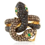 A COLOURED DIAMOND AND EMERALD DOUBLE SNAKE RING in 18ct yellow gold designed as two serpents, their