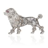 AN ANTIQUE DIAMOND AND RUBY POODLE BROOCH in gold and silver, depicting a poodle, set with round cut