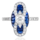 A SAPPHIRE AND DIAMOND DRESS RING in 18ct white gold, the 0.28 carat round cut sapphire within