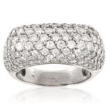 A DIAMOND BOMBE DRESS RING in 18ct white gold, the rectangular body jewelled allover with round