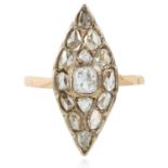 AN ANTIQUE ART DECO DIAMOND RING in platinum and gold, the marquise face set with a central old mine