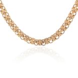 A GOLD FANCY LINK NECKLACE in high carat yellow gold, the fancy link necklace is set with engraved