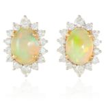 A PAIR OF OPAL AND DIAMOND EAR STUDS in 18ct yellow gold, each set with a cabochon opal of