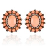 A PAIR OF CORAL AND DIAMOND EARRINGS in 18ct yellow gold, each set with a central oval cabochon