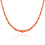 AN ANTIQUE CORAL BEAD NECKLACE comprising a single row of one hundred and thirty two graduated