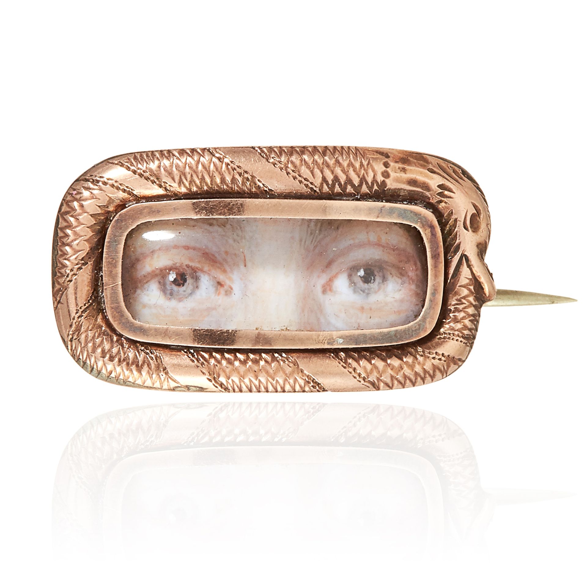 AN ANTIQUE SEEING EYE PORTRAIT MINIATURE MOURNING BROOCH in yellow gold, the rounded rectangular
