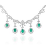 AN EMERALD AND DIAMOND NECKLACE, in 18ct white gold, set with round diamonds and five pear cut
