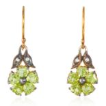 A PAIR OF PERIDOT AND DIAMOND EARRINGS in silver and gold, each set with five heart cut peridot in a