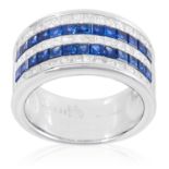 A SAPPHIRE AND DIAMOND HALF ETERNITY RING in 18ct white gold, comprising five rows of alternating