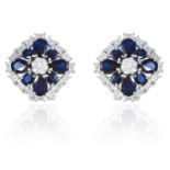 A PAIR OF SAPPHIRE AND DIAMOND CLUSTER EARRINGS in 18ct white gold, jewelled with round and baguette