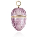 AN ANTIQUE ENAMELLED EGG PENDANT the hinged egg opening with hollow interior, the exterior decorated