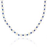 A PEARL AND LAPIS LAZULI BEAD NECKLACE comprising of alternating pearl and faceted lapis lazuli