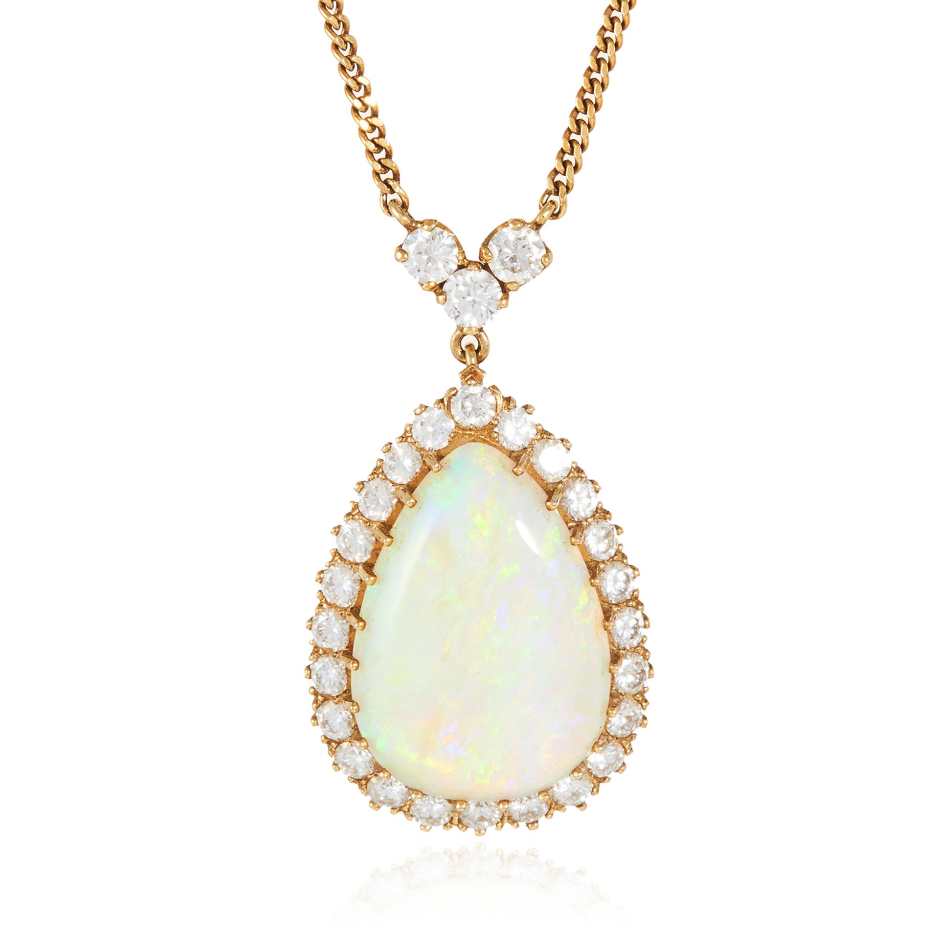 AN OPAL AND DIAMOND PENDANT NECKLACE in 18ct yellow gold, the large pear shaped cabochon encircled