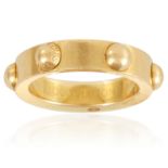 A GOLD BAND RING, LOUIS VUITTON in 18ct yellow gold, decorated with half-spheres, signed Louis