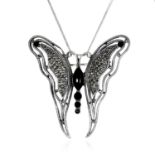AN ANTIQUE ONYX AND MARCASITE BUTTERFLY BROOCH in silver, designed as a butterfly, set with onyx and