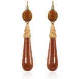 A PAIR OF ANTIQUE GOLDSTONE EARRINGS, 19TH CENTURY the tapering, polished goldstone drops below oval