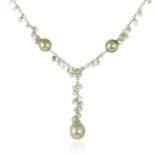A PEARL AND SAPPHIRE NECKLACE in 18ct white gold, set with a central cushion cut sapphire of 1.44